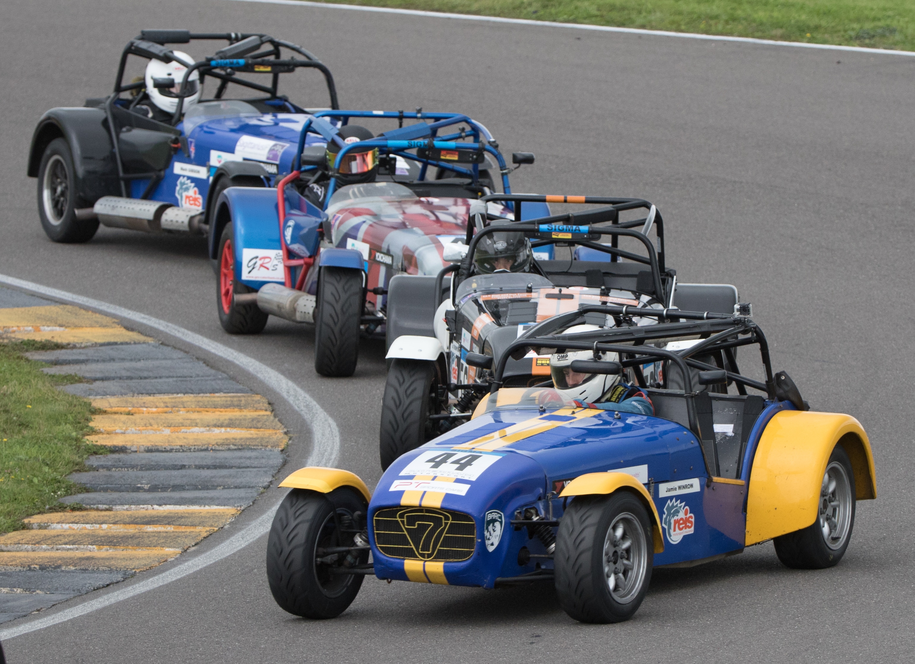 A pack of Caterhams racing together