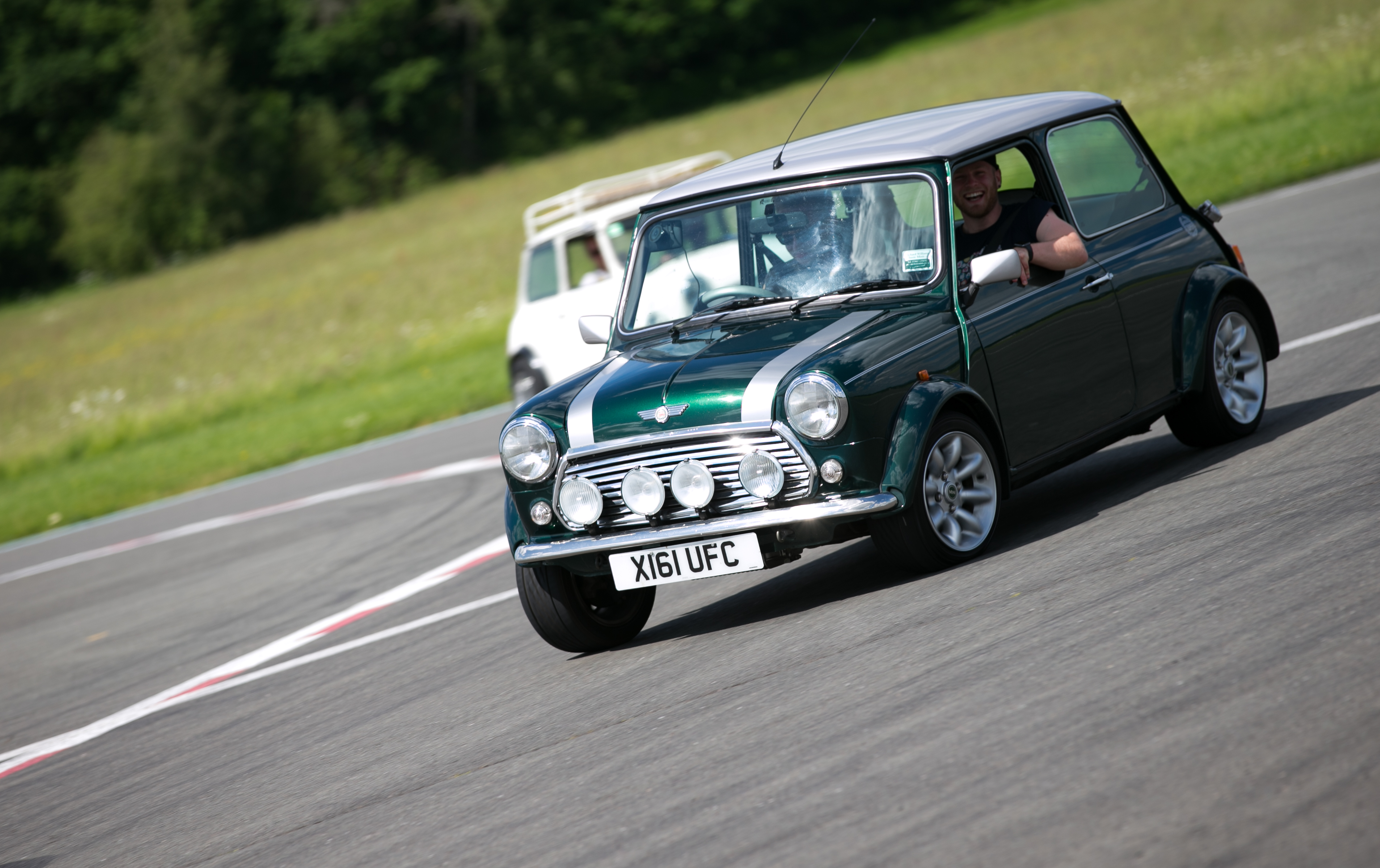 Rover Mini leaning through a corner on track